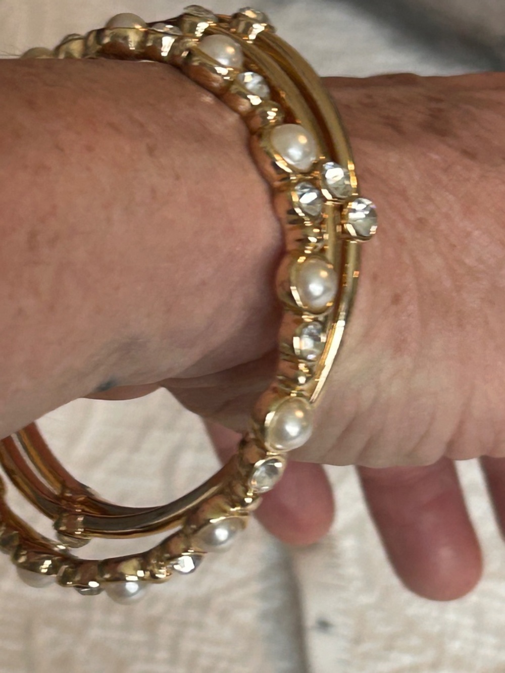 Three Anne Klein Gold Tone Rhinestone and Pearl Bangle Bracelet Set - Picture 4 of 7